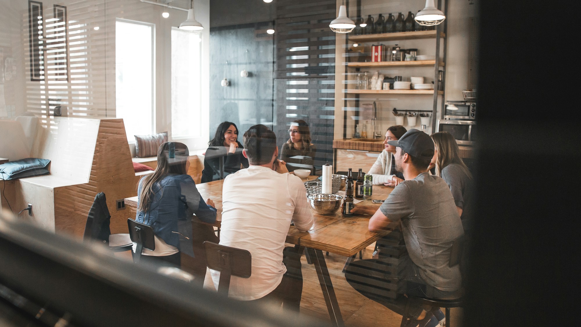 people sitting around a table talking