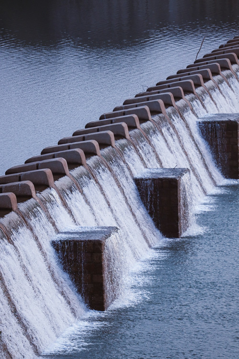 water gushing out of a dam